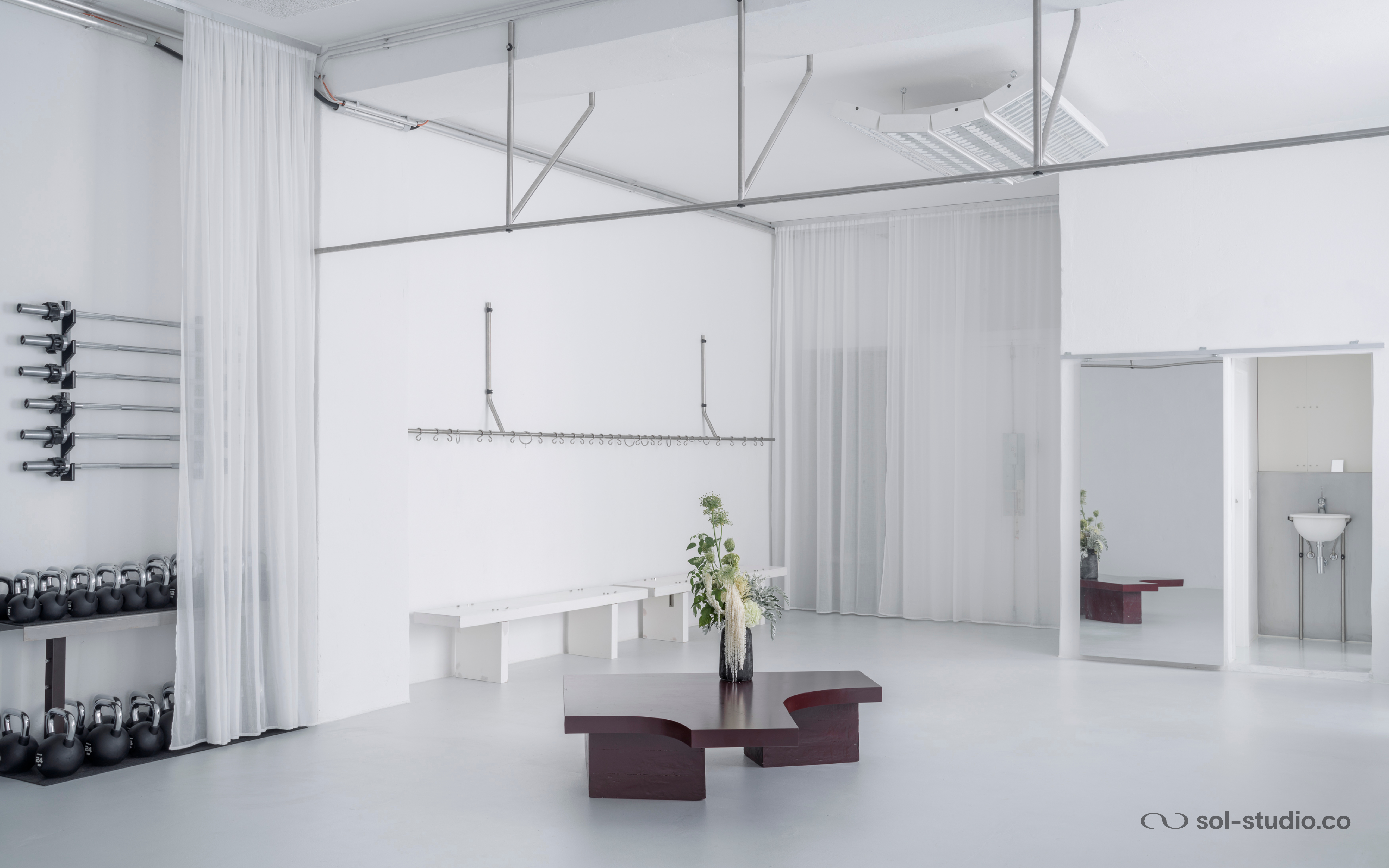 sol studio pilates + strength entrance view with weight shelf sol